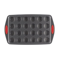 Non-stick 24-cup mini muffin pan with red silicone handles.