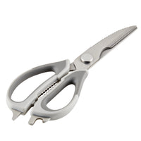 Silver kitchen scissors with serrated blades on a white background.