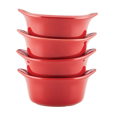 Four stacked red ceramic bowls.