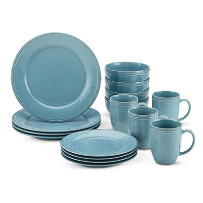 A set of blue ceramic dinnerware including plates, bowls, and mugs.