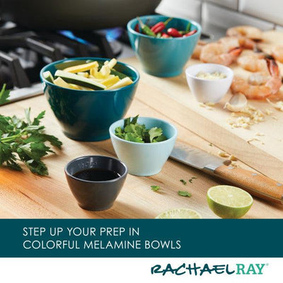 Colorful melamine bowls on a countertop with various ingredients.