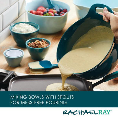 Batter being poured onto a griddle from a bowl with a spout.