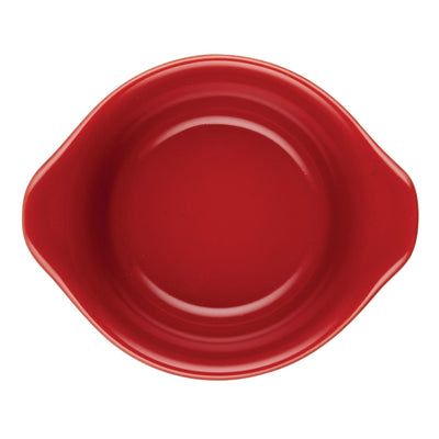 Red ceramic bowl with handles, viewed from above.