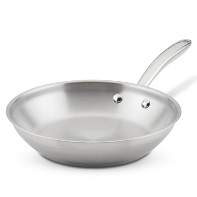 Stainless steel frying pan with a handle, viewed from the side.