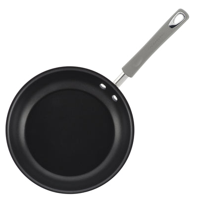 Non-stick frying pan with a gray handle shown from above.