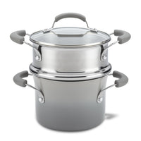 Stainless steel double boiler with glass lid and gray handles.