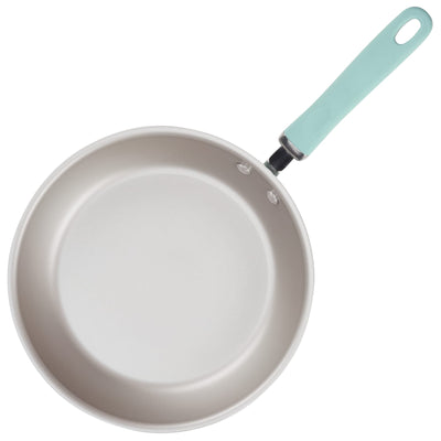 A frying pan with a light blue handle.