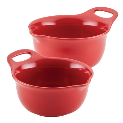 Two red mixing bowls with handles, stacked on top of each other.