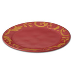 Red plate with gold decorative pattern around the rim.