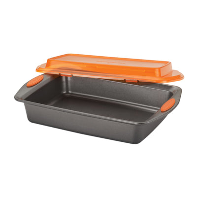 Gray baking pan with orange handles and a matching orange lid.