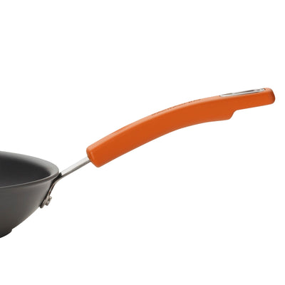 Frying pan with an orange handle on a white background.