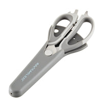 Gray multipurpose scissors with a sheath and ergonomic handles.