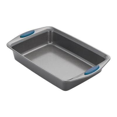 Rectangular metal baking pan with blue silicone grips on the handles.