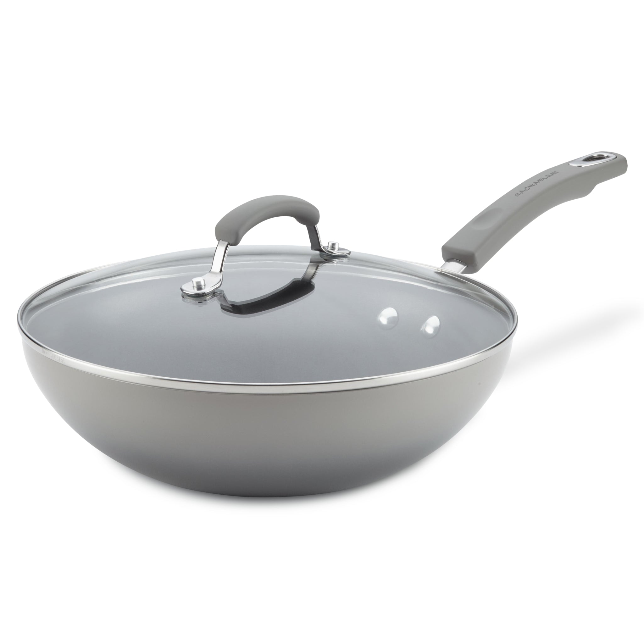 Gray nonstick wok with a glass lid and ergonomic handle.