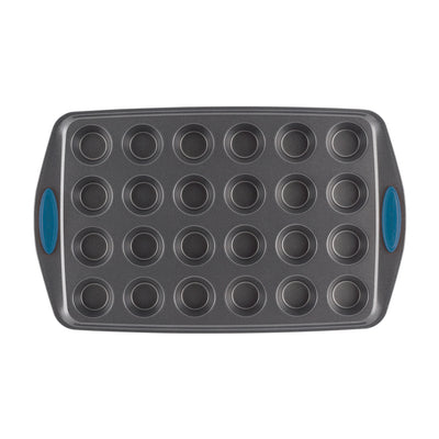 Gray muffin pan with 24 cups and blue handles.