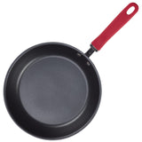 Nonstick frying pan with a red handle on a white background.