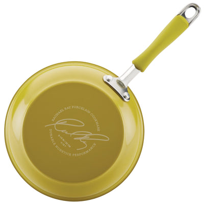 Green nonstick frying pan with a logo and a sturdy handle facing left.