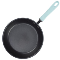 A non-stick frying pan with a light blue handle.