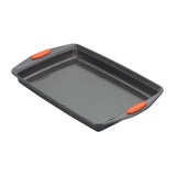 Rectangular gray baking pan with orange grips on the handles.