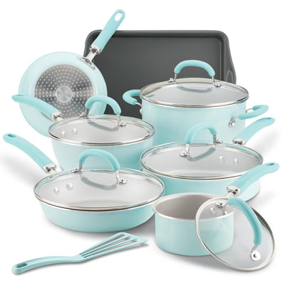 Set of turquoise cookware with glass lids and a baking sheet.