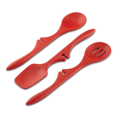 Three red kitchen utensils: spatula, slotted spoon, and solid spoon.