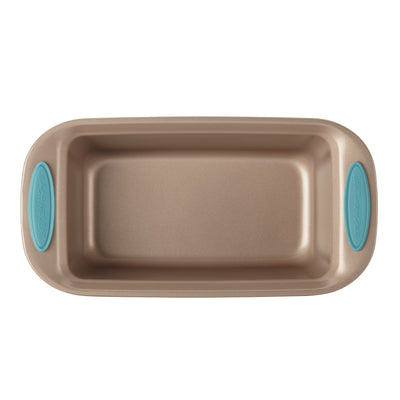 Gold loaf pan with teal silicone handles, viewed from above.