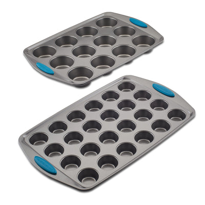 Two muffin pans with blue handles on a white background.