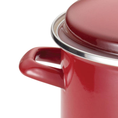 Partial view of a red cooking pot with a lid and side handle.