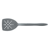 Gray slotted spatula with a series of holes on the flat surface.