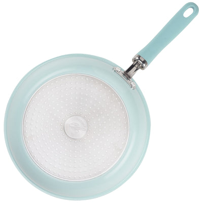 A light blue frying pan with a silver non-stick interior and handle.