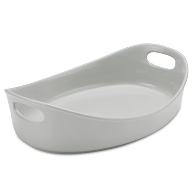 Oval white ceramic baking dish with handles on each side.