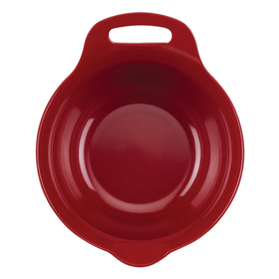 Red ceramic baking dish with a handle, viewed from above.