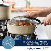 Person lifting lid from pan with steaming vegetables on a gas stove.
