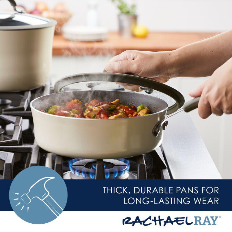 Person lifting lid from pan with steaming vegetables on a gas stove.