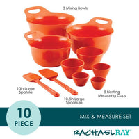 Orange mixing and measuring set with bowls, spatulas, and cups.