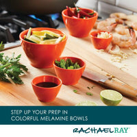 Various ingredients in orange bowls near a knife on a kitchen counter.