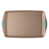 Rectangular baking sheet with teal handles on both sides.