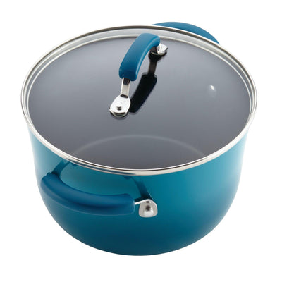 A blue pot with a glass lid and matching handles.