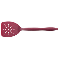 Red slotted spatula with a long handle on a white background.