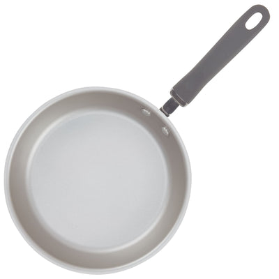 A gray frying pan with a black handle, viewed from above.