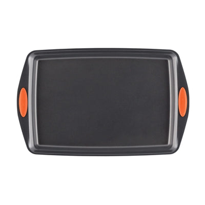 Black baking sheet with orange handles, viewed from above.