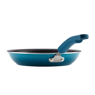 Blue frying pan with a non-stick surface and ergonomic handle.