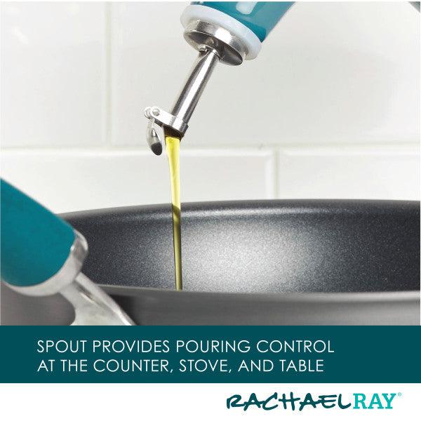 Using the EVOO Bottle 24-Ounce, oil is being poured with precision from a stainless steel pour spout into a pan.