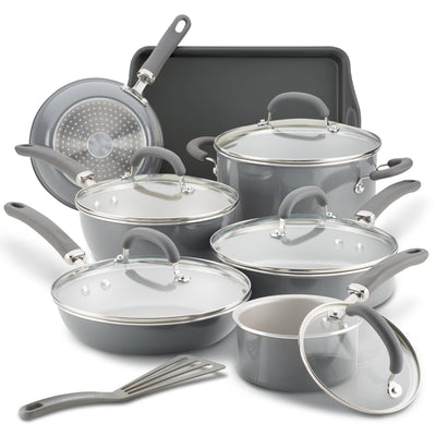 A cookware set including pots, pans, lids, spatula, and a baking tray.