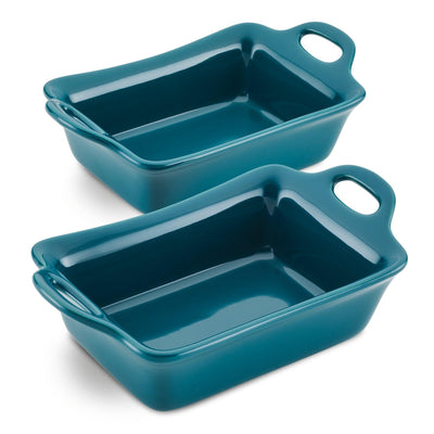 Two teal ceramic baking dishes with handles, stacked.