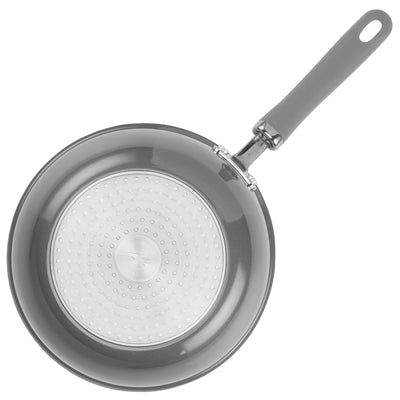 Non-stick frying pan with a grey handle and silver bottom view.