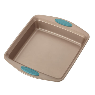 Square baking pan with teal silicone grips on the handles.