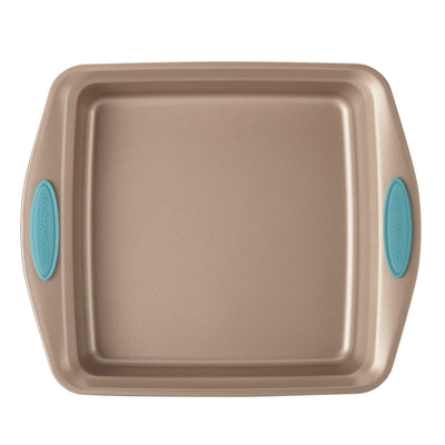 Square baking pan with turquoise silicone grips on handles.