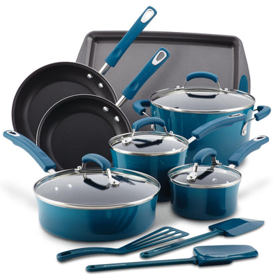 Blue non-stick cookware set with pots, pans, and kitchen utensils.