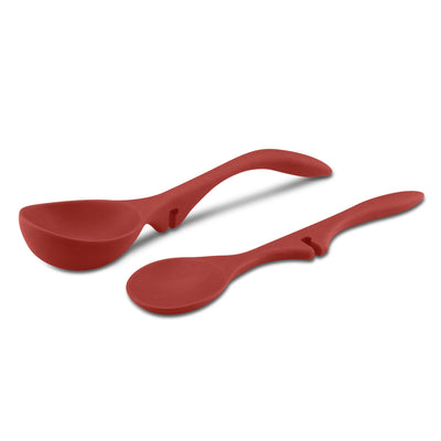 Two red silicone kitchen spoons with curved handles on a white background.